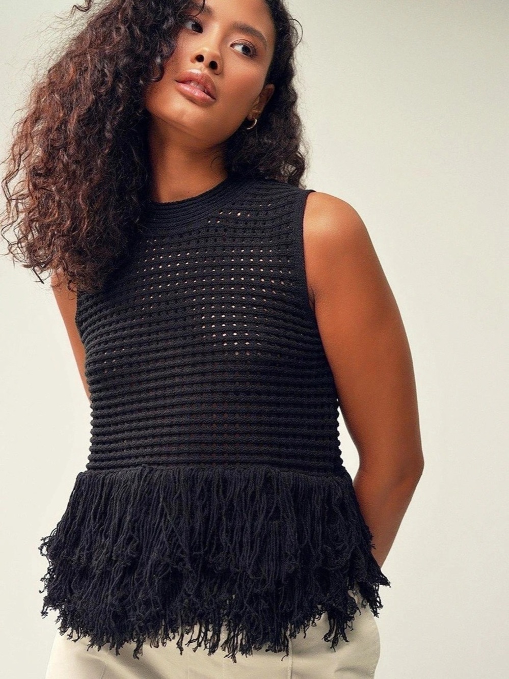 Small Zara Open-Knit Fringe Sleeveless Top in black.